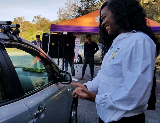 Kamera Scott checks out the self-driving car at the UTC conference.